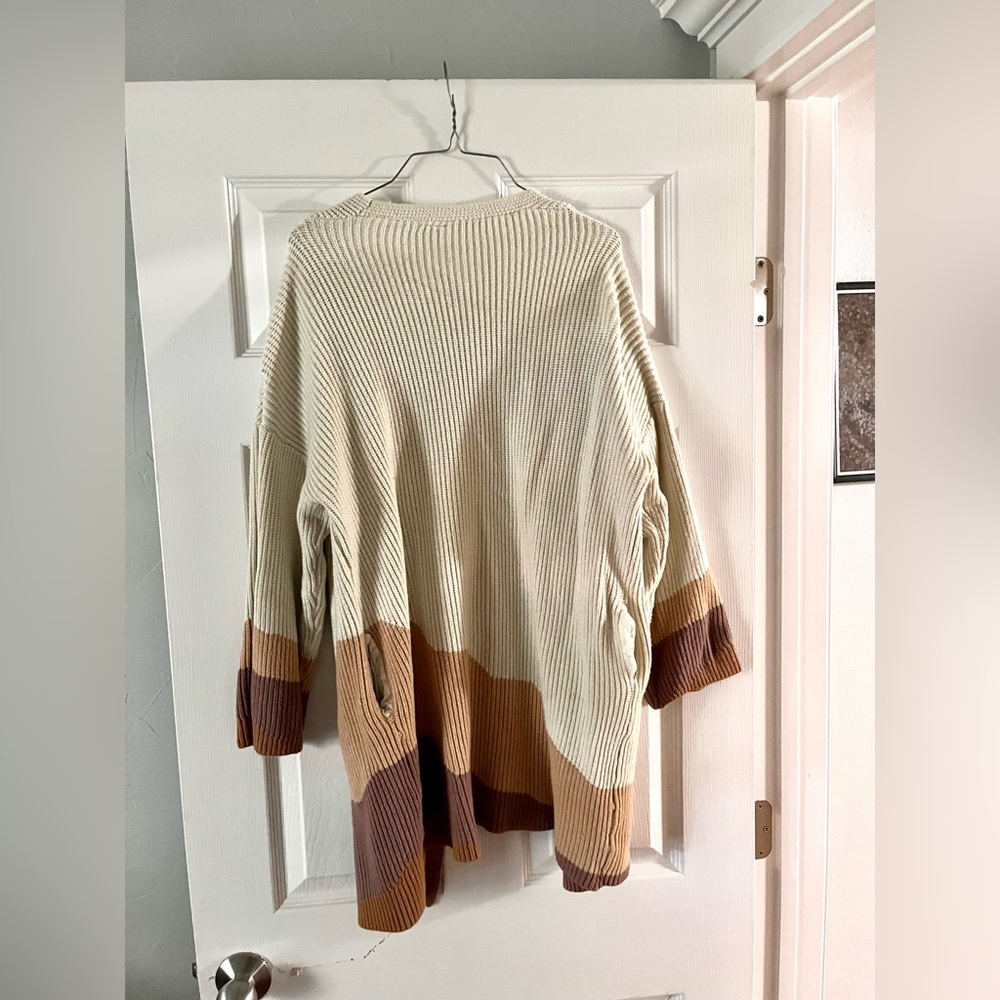 Cream, toupe, mauve, and brown. long, long sleeve, cardigan.